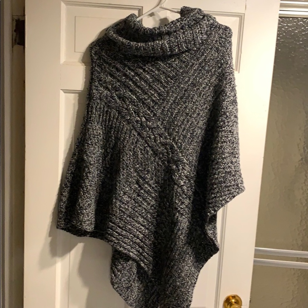White black and grey turtleneck sweater poncho